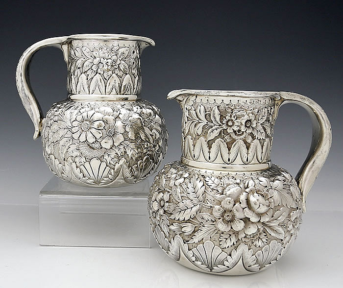 pair of Whiting antique sterling repousse pitchers