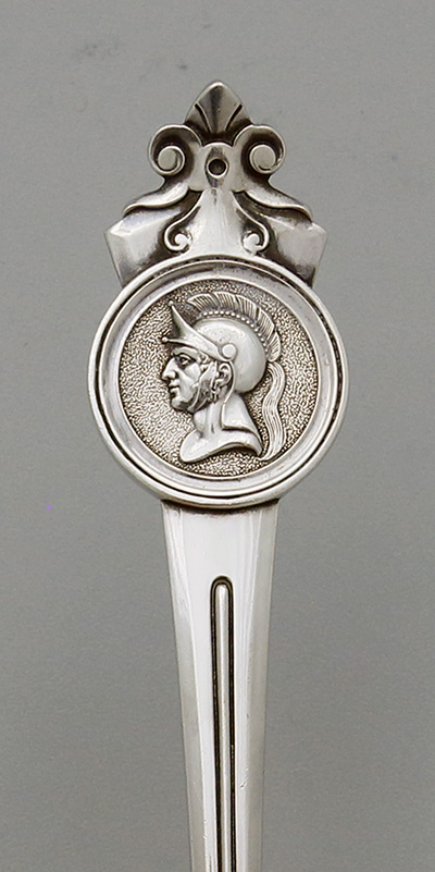 detail of Gorham medallion handle on serving spoon