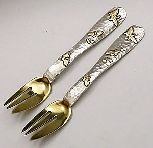 pair of Tiffany & Company hammered applied and gilded forks