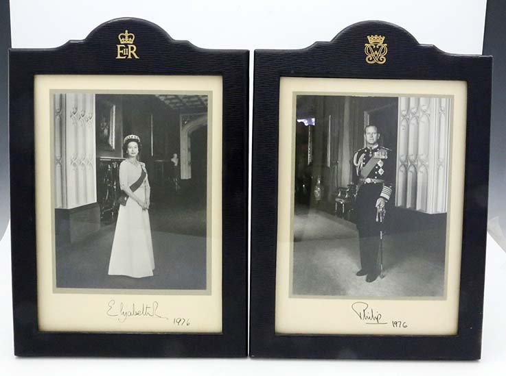 pair of Royal signed pictures of Queen Elizabeth and Prince Philip framed in leather frames