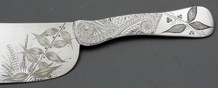 details of engraving on handle of antique ice cream knife J E Caldwell
