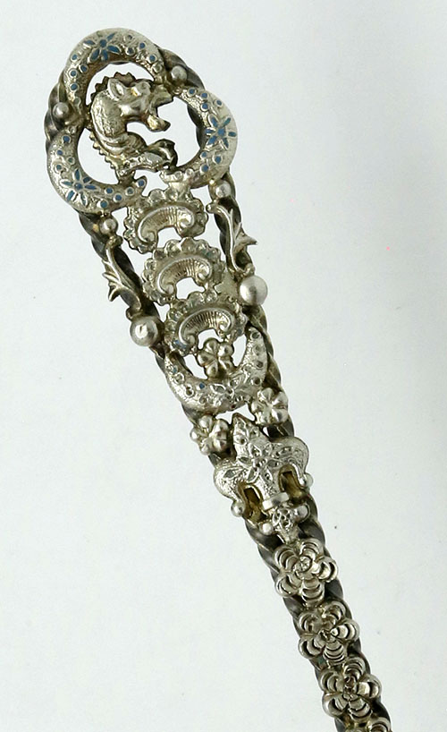 handle of French and Franklin sterling cheese scoop