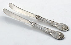 Pair coin silver right angle butter knives