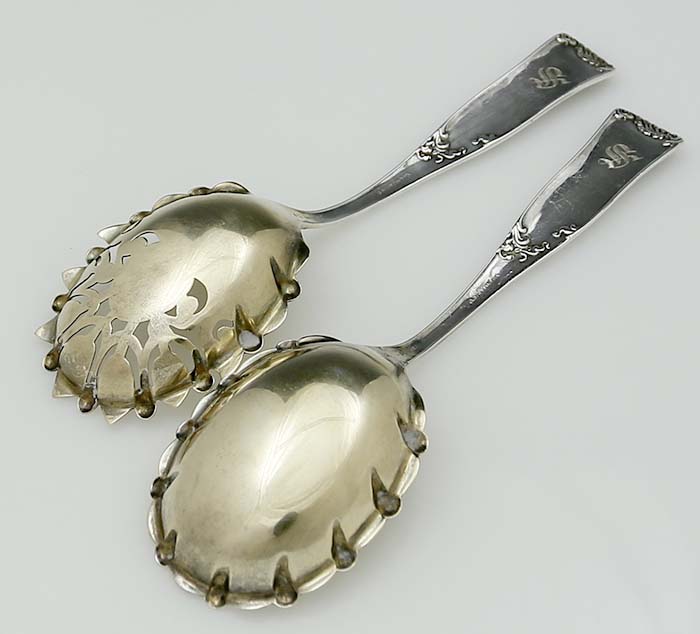 reverse of pair of antique sterling silver spoons