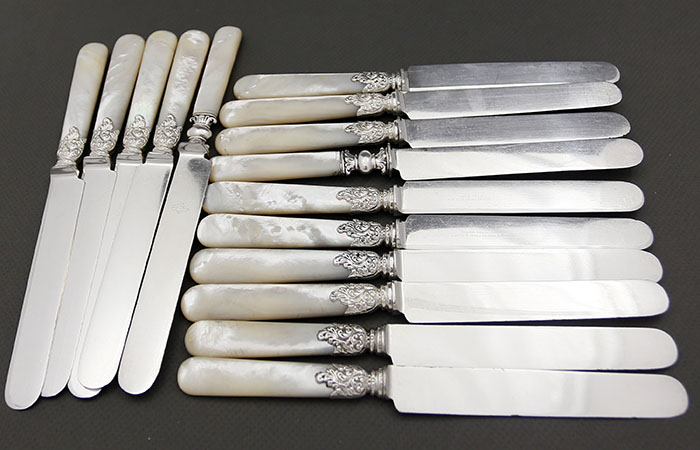 fifteen antique silver plated mother of pearl handled knives