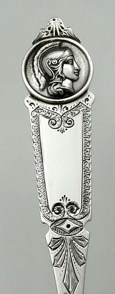 detail of medallion and engraving on William Gale cheese scoop