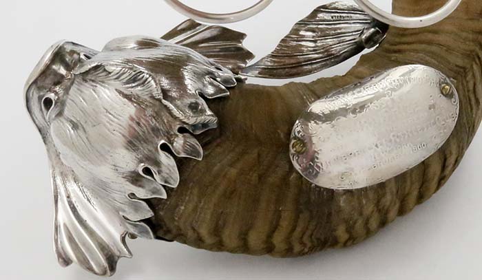 close up of fish head cast sterling on Black Starr Frost decanter