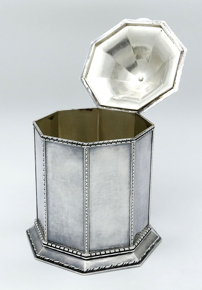 view of hinged lid opened showing interior of Guild of Handicrafts hammered tea caddy box