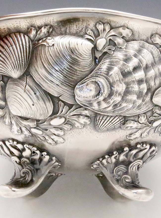 detail of shells chased on Whiting antique sterling silver bowl