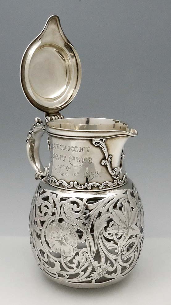 lip hinged open on Whiting antique silver overlay carafe