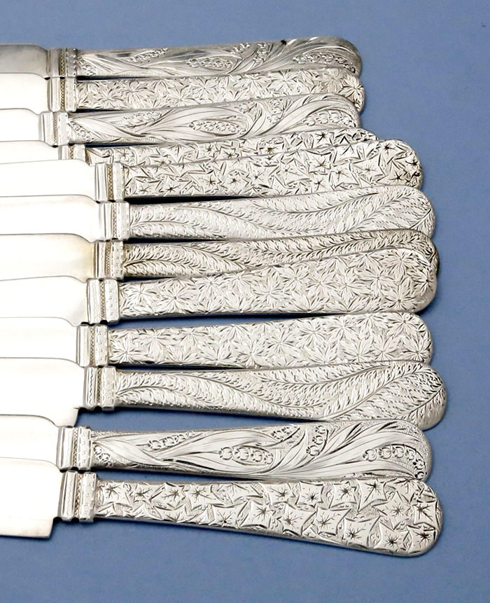 engraved handles of Shiebler sterling silver tea k ives