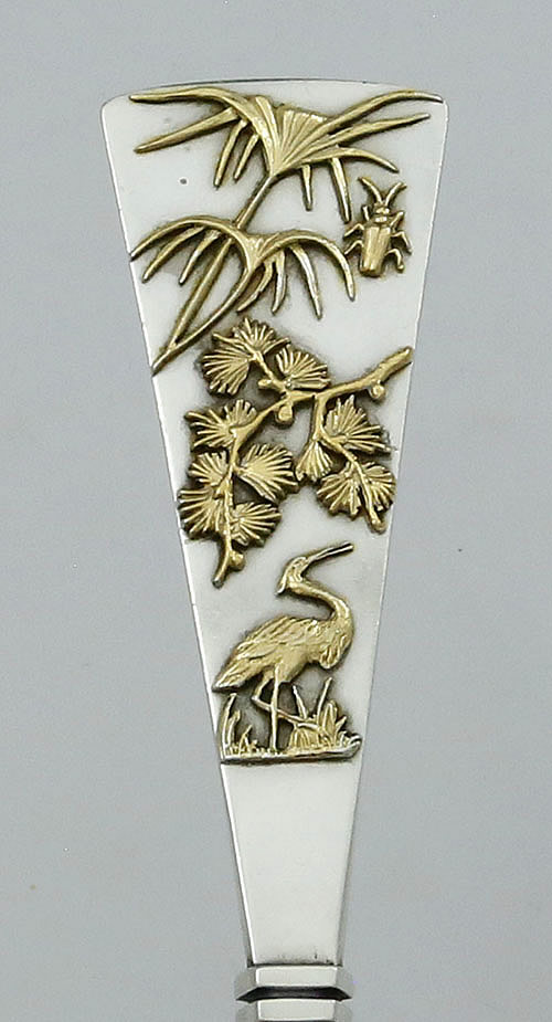 applied crane and bug with flowers on Shiebler serving spoon