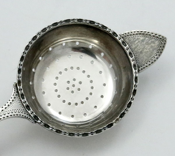 bowl of English silver tea strainer