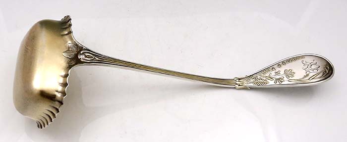 Rear view of Tiffany Japanese antique sterling silver ladle with square bowl with ruffled edges