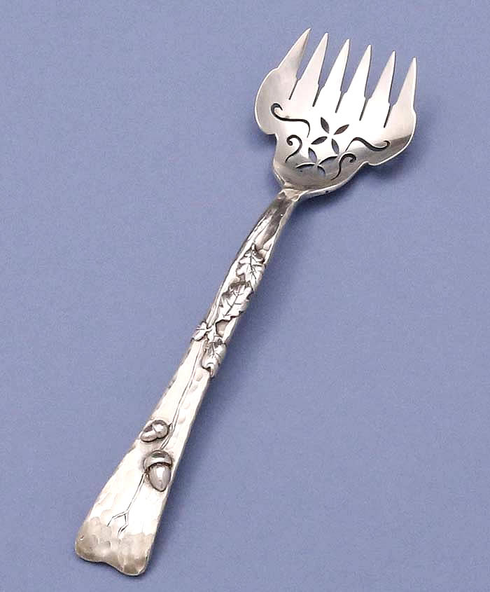 Tiffany lap over edge antique sterling sardine fork applied with acorns