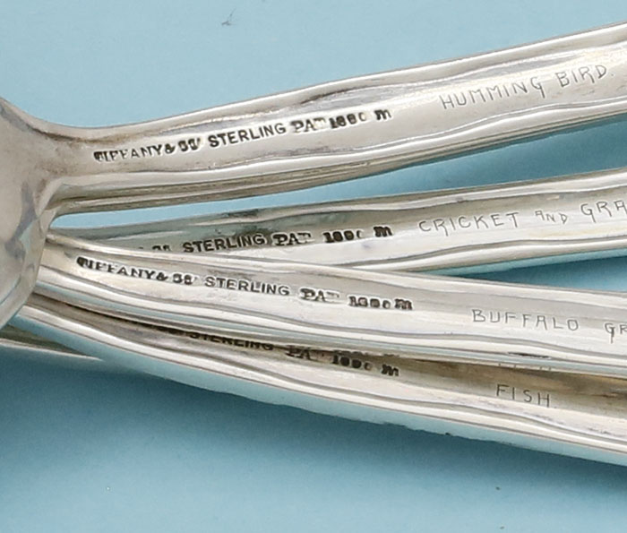 reverse of handles showing the names on Tiffany lap over edge dessert spoons