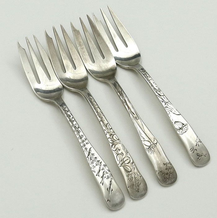 Set of 9 Tiffany lap over edge oyster forks