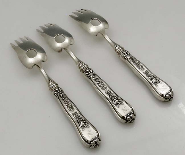 reverse of Tiffany Olympian fish forks with hollow handles