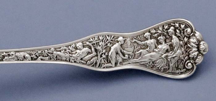 detail of handle of Tiffany antique sterling Olympian pie server serrated