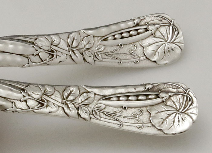 detail of peapod by Tiffany on handles of salad serving set