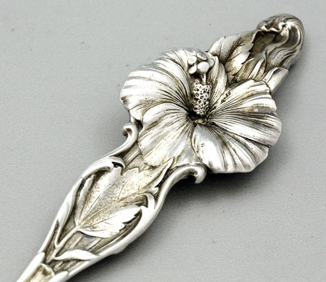 reverse of handle on Whiting Hibiscus salad serving set